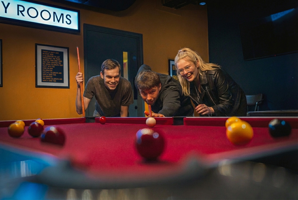 Image of people playing pool at Allstars Sports Bowl